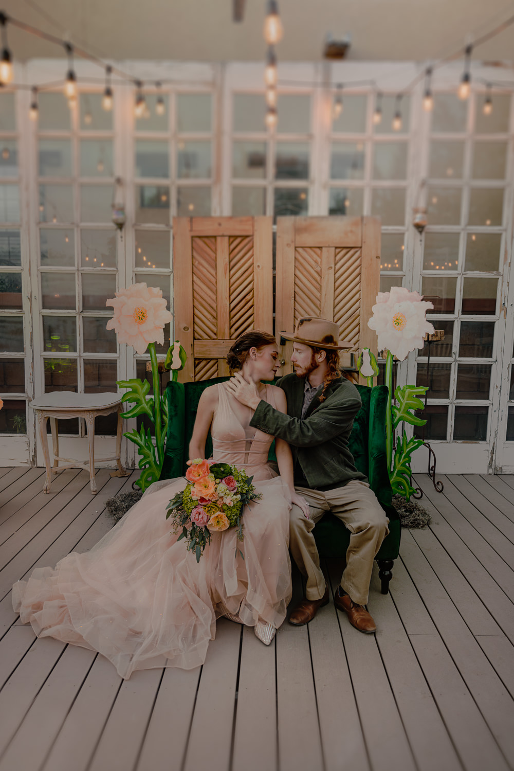 Door Backdrop Large Paper Flowers Festoon Lights Ceremony Aisle Wizard Oz Emerald City Wedding Claire Gutierrez Photography