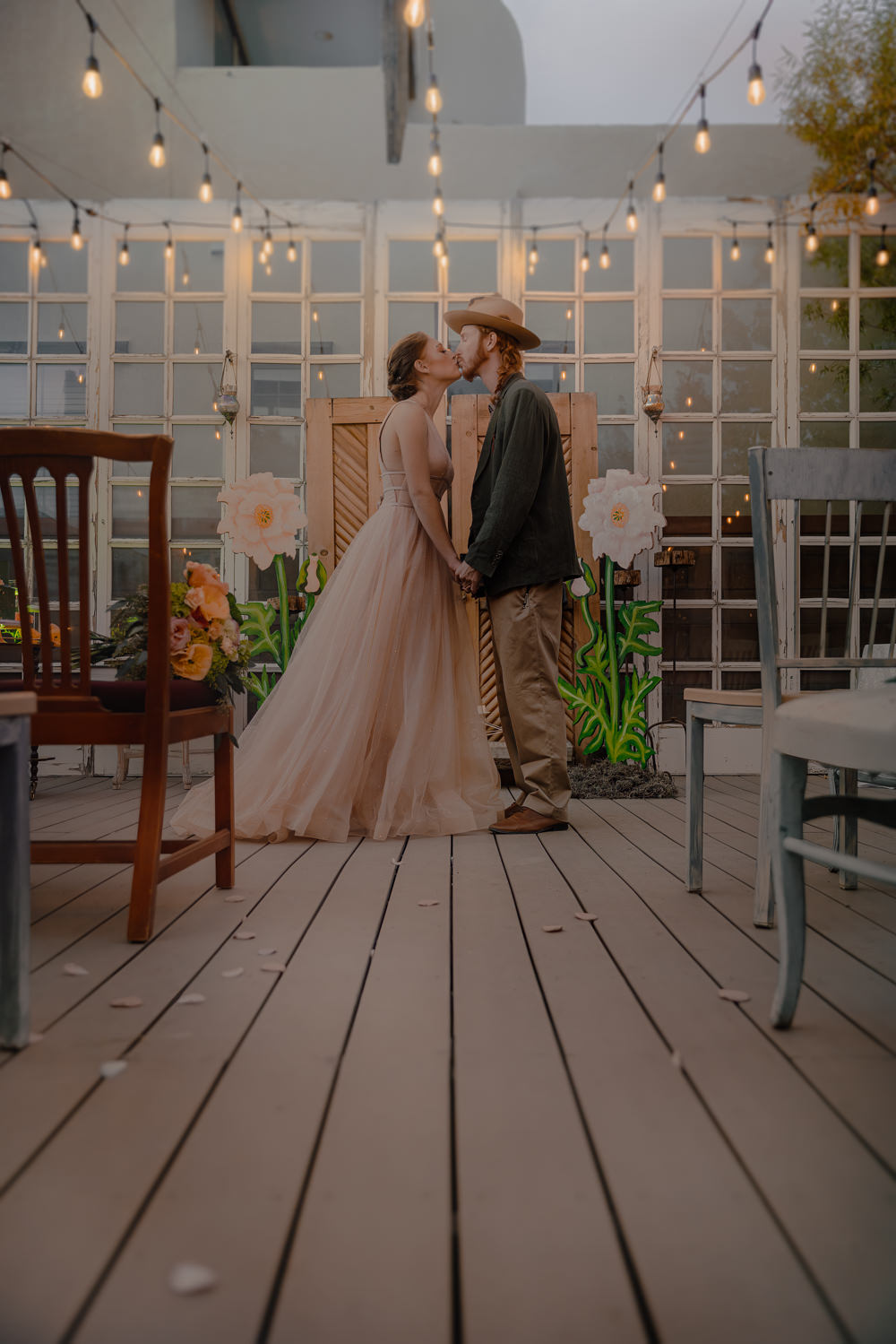 Door Backdrop Large Paper Flowers Festoon Lights Ceremony Aisle Wizard Oz Emerald City Wedding Claire Gutierrez Photography