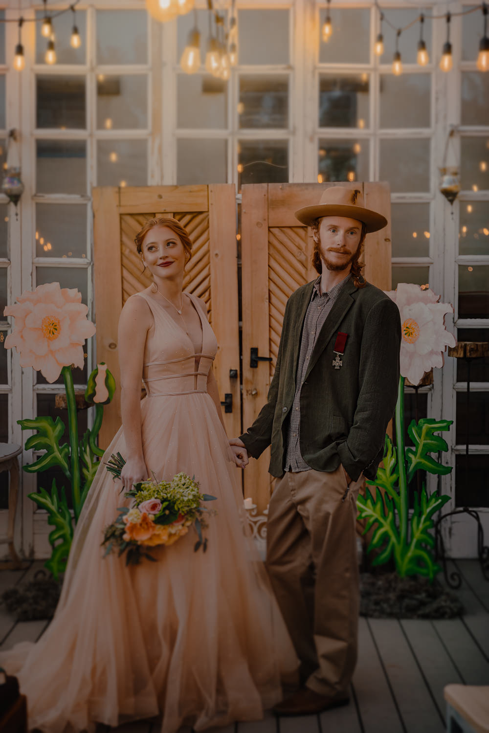 Door Backdrop Large Paper Flowers Festoon Lights Ceremony Aisle Wizard Oz Emerald City Wedding Claire Gutierrez Photography