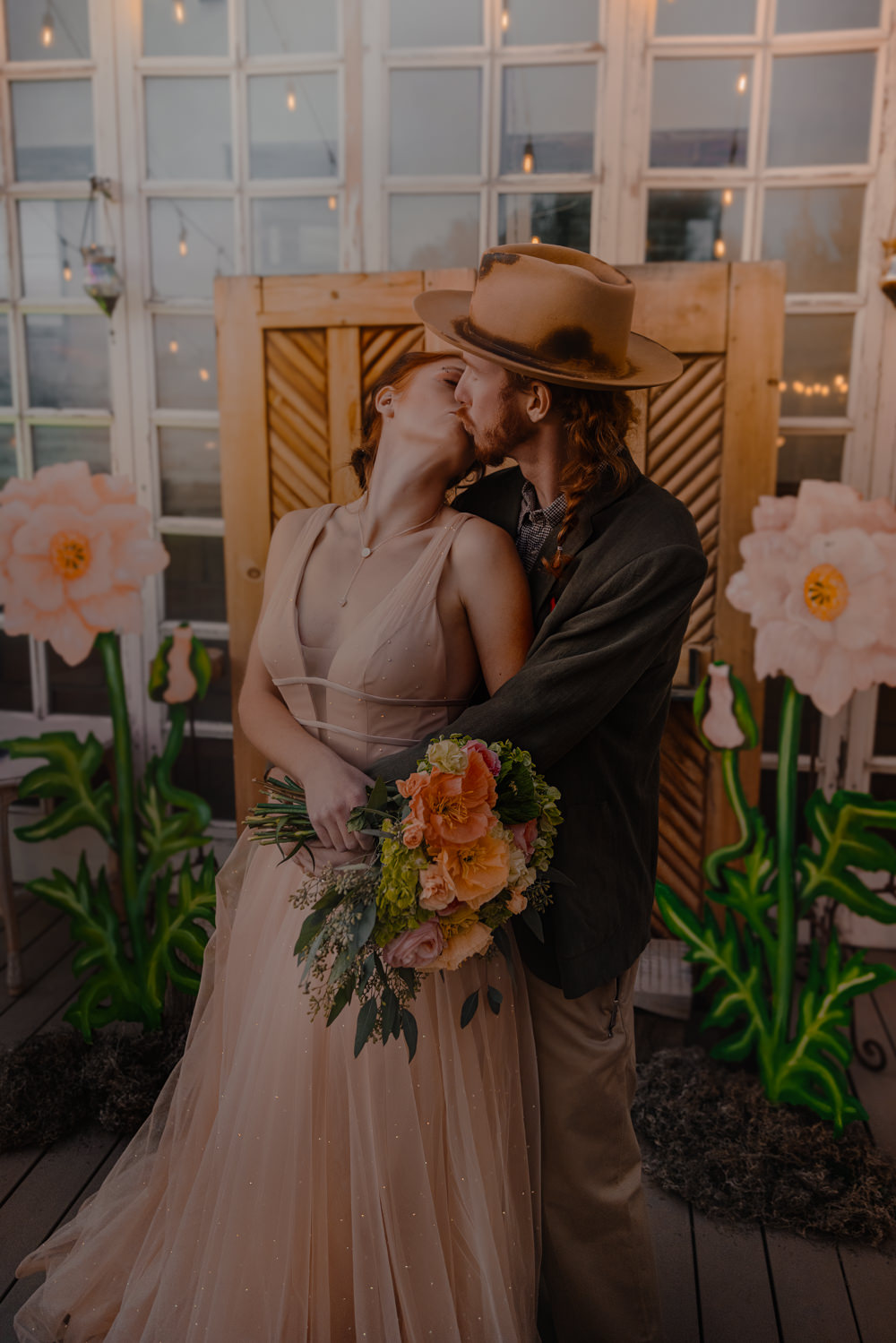 Door Backdrop Large Paper Flowers Festoon Lights Ceremony Aisle Wizard Oz Emerald City Wedding Claire Gutierrez Photography