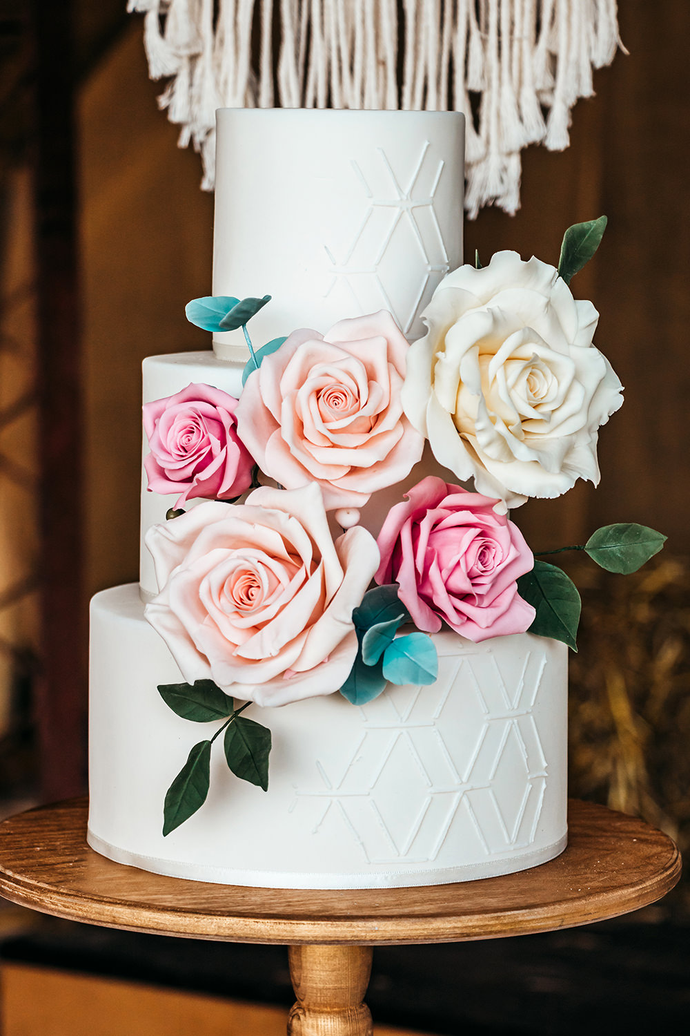 White Iced Cake Flowers Aircraft Hangar Wedding Sherri OMalley Photography