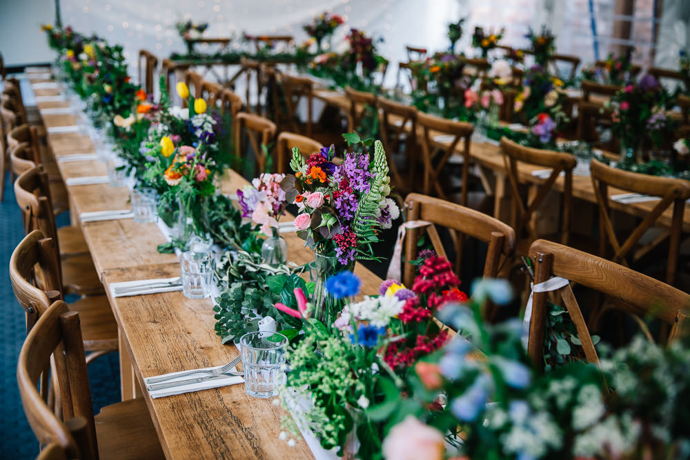 Long Wooden Tables Colourful Flowers Greenery Decor Centrepiece Beauvale Priory Wedding Lisa Marie Halliday