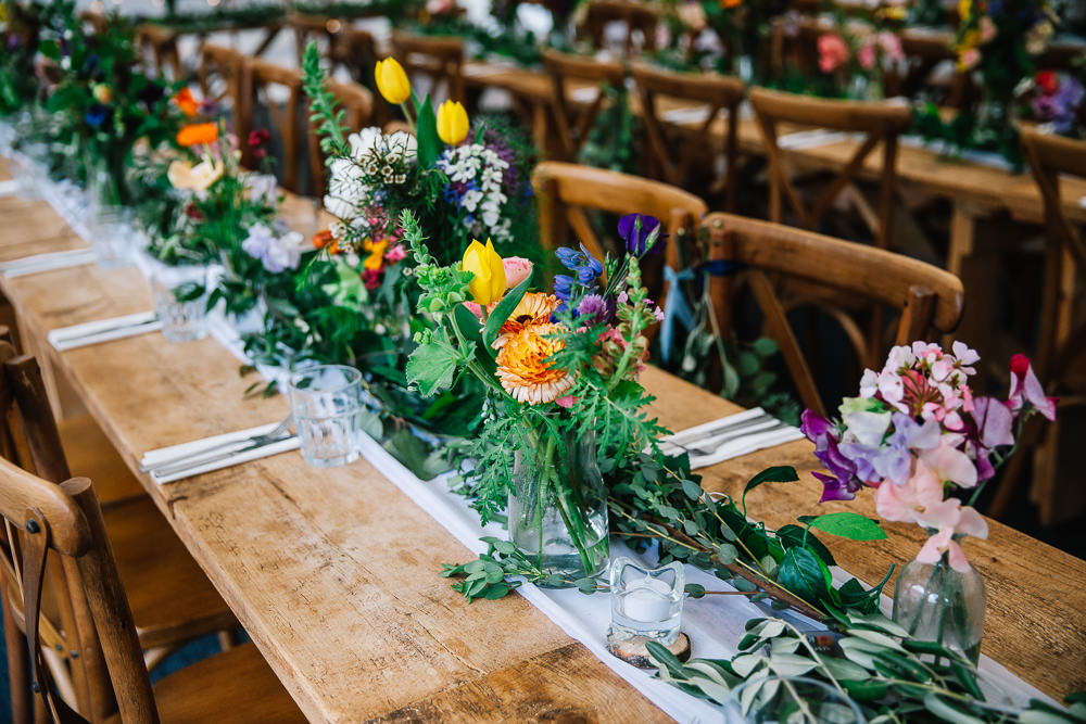 Long Wooden Tables Colourful Flowers Greenery Decor Centrepiece Beauvale Priory Wedding Lisa Marie Halliday