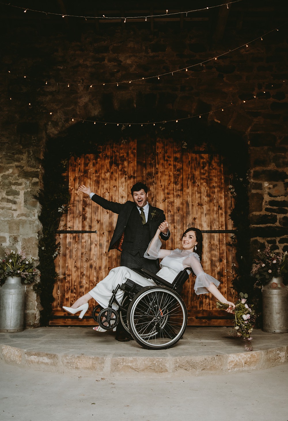 Little Seed Field Wedding Louise Pollitt Photography Bride Wheelchair Fairy Lights Barn Greenery Arch