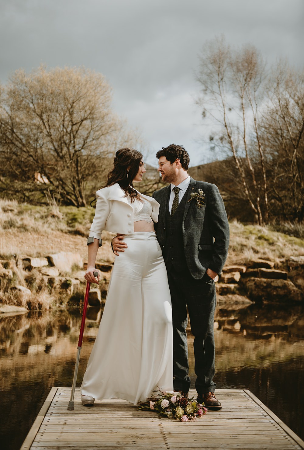 Bride Trousers Top Jacket Crutches Little Seed Field Wedding Louise Pollitt Photography