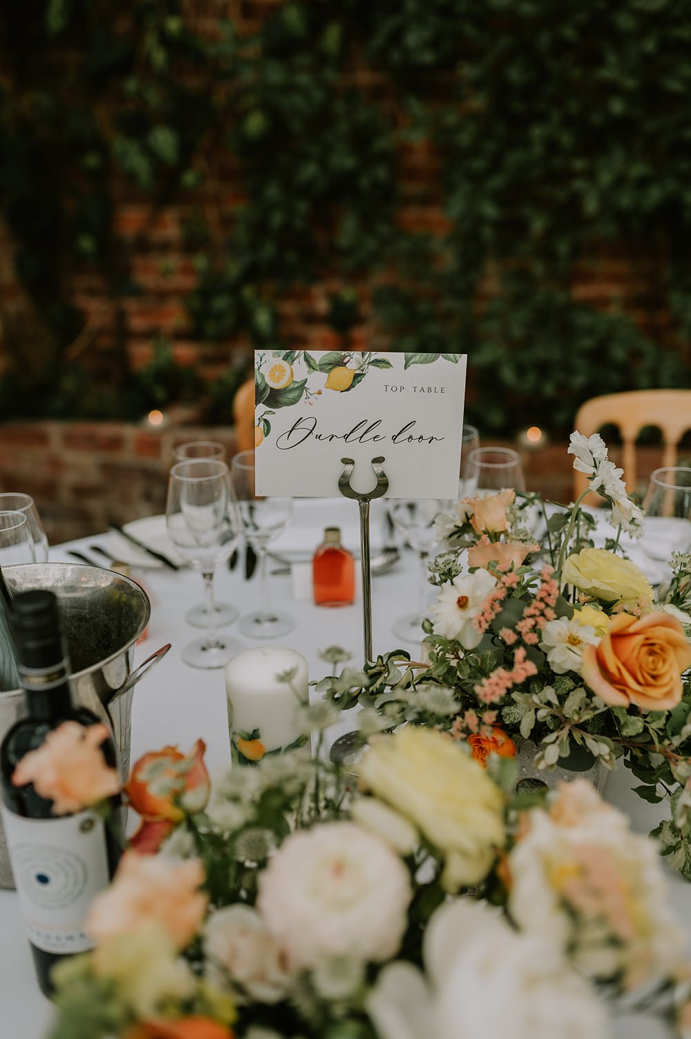 Table Flowers Yellow Peach Spring Centrepiece Northbrook Park Wedding Lucy Dracott Photography
