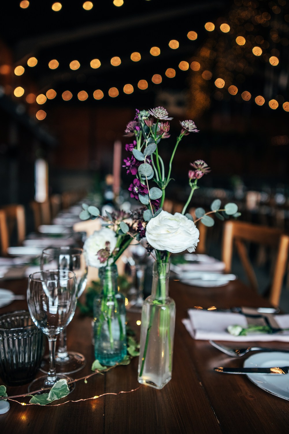 Glass Bottle Flowers Centrepiece Red Greenery Wedding Three Flowers Photography