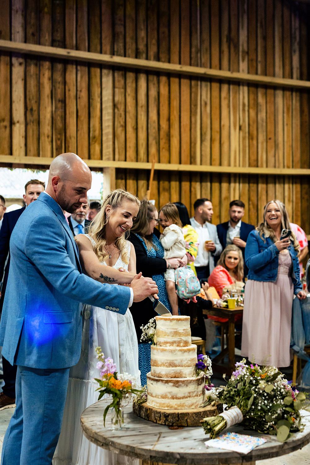 Semi Naked Cake Flowers Log Slice Stand Rushmere Farm Workshops Wedding Jason Williams Photography