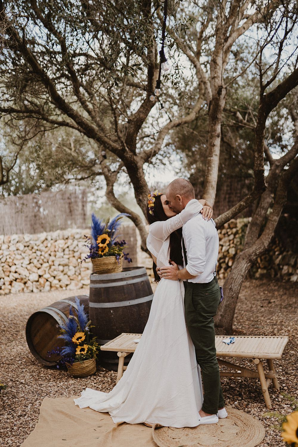 Ceremony Tree Backdrop Wooden Barrels Sunflowers Binifadet Wedding Laura Mazzello Photography