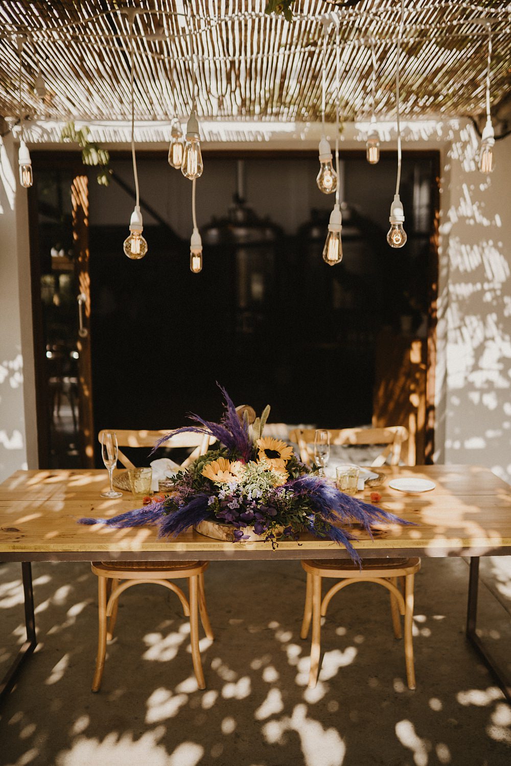 Top Sweetheart Table Purple Yellow Flowers Festoon Lights Binifadet Wedding Laura Mazzello Photography