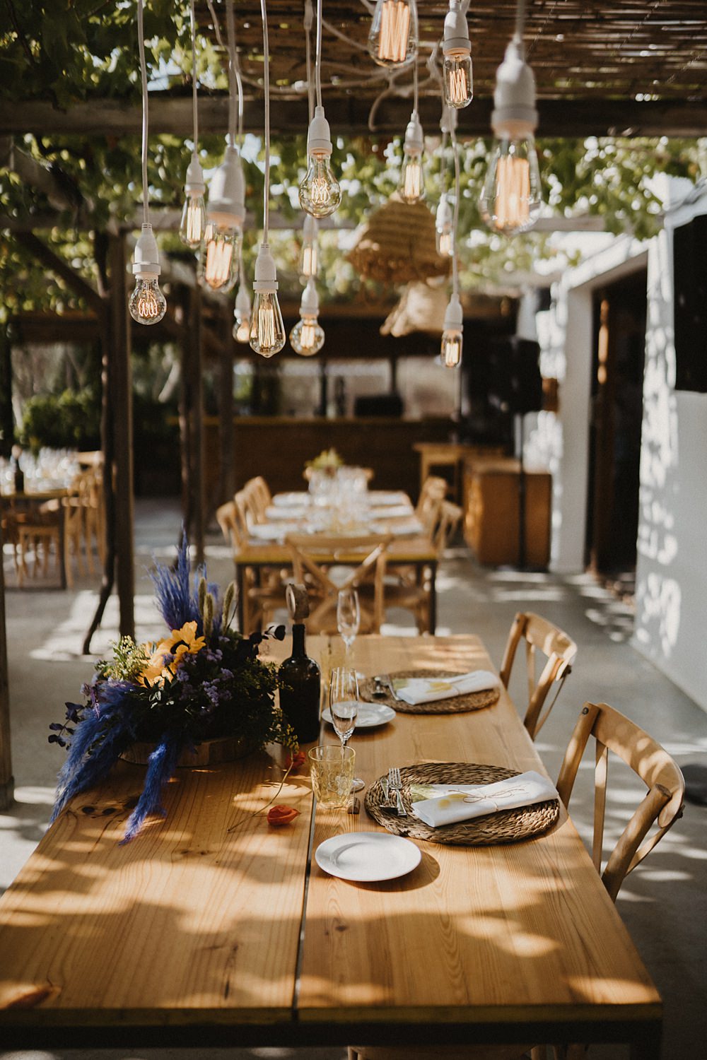 Top Sweetheart Table Purple Yellow Flowers Festoon Lights Binifadet Wedding Laura Mazzello Photography