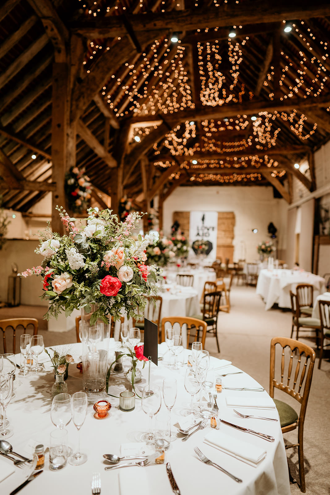 Fairy Lights Tall Flower Centrepieces Brighton Barn Wedding Kim Williams Weddings