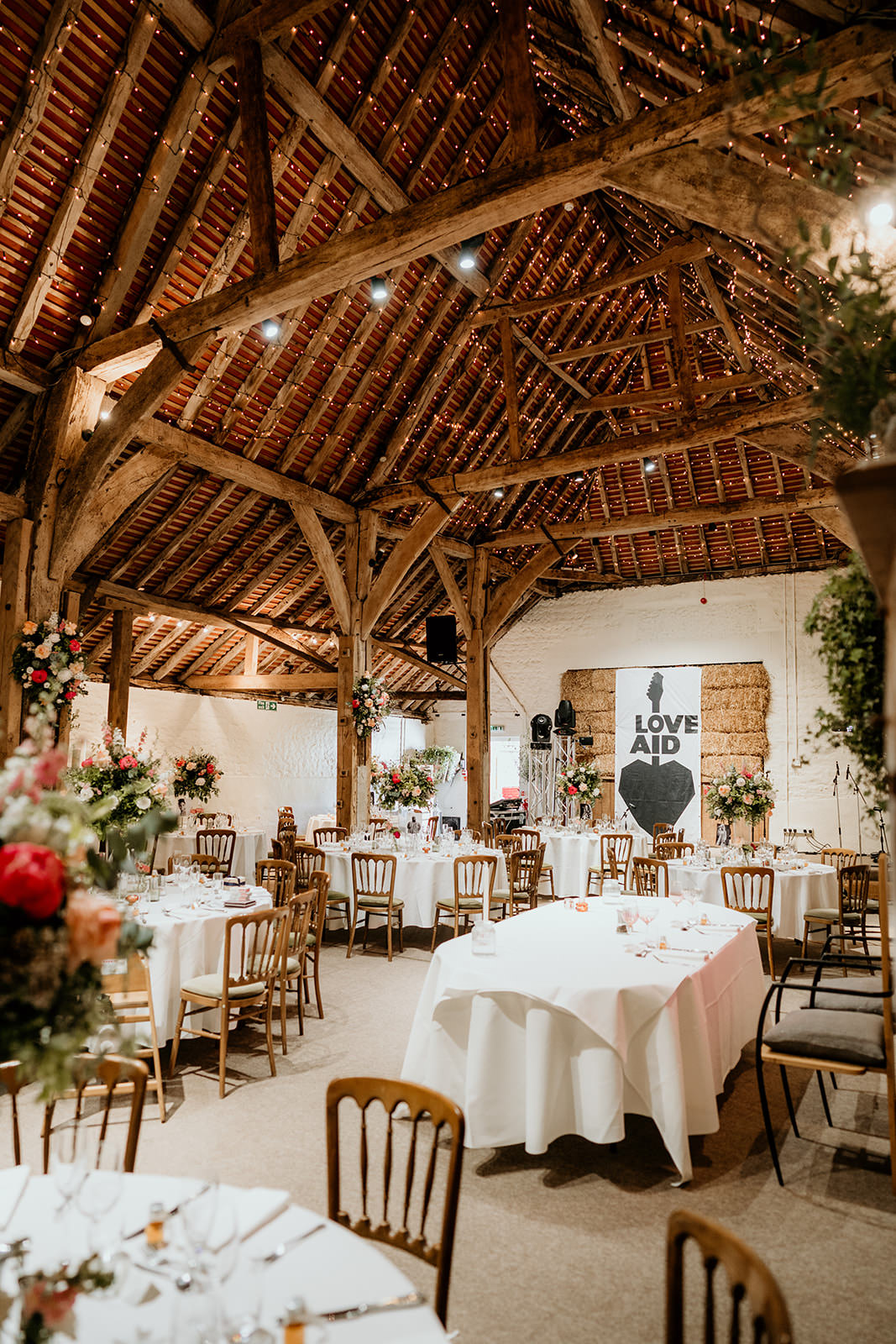 Fairy Lights Tall Flower Centrepieces Brighton Barn Wedding Kim Williams Weddings