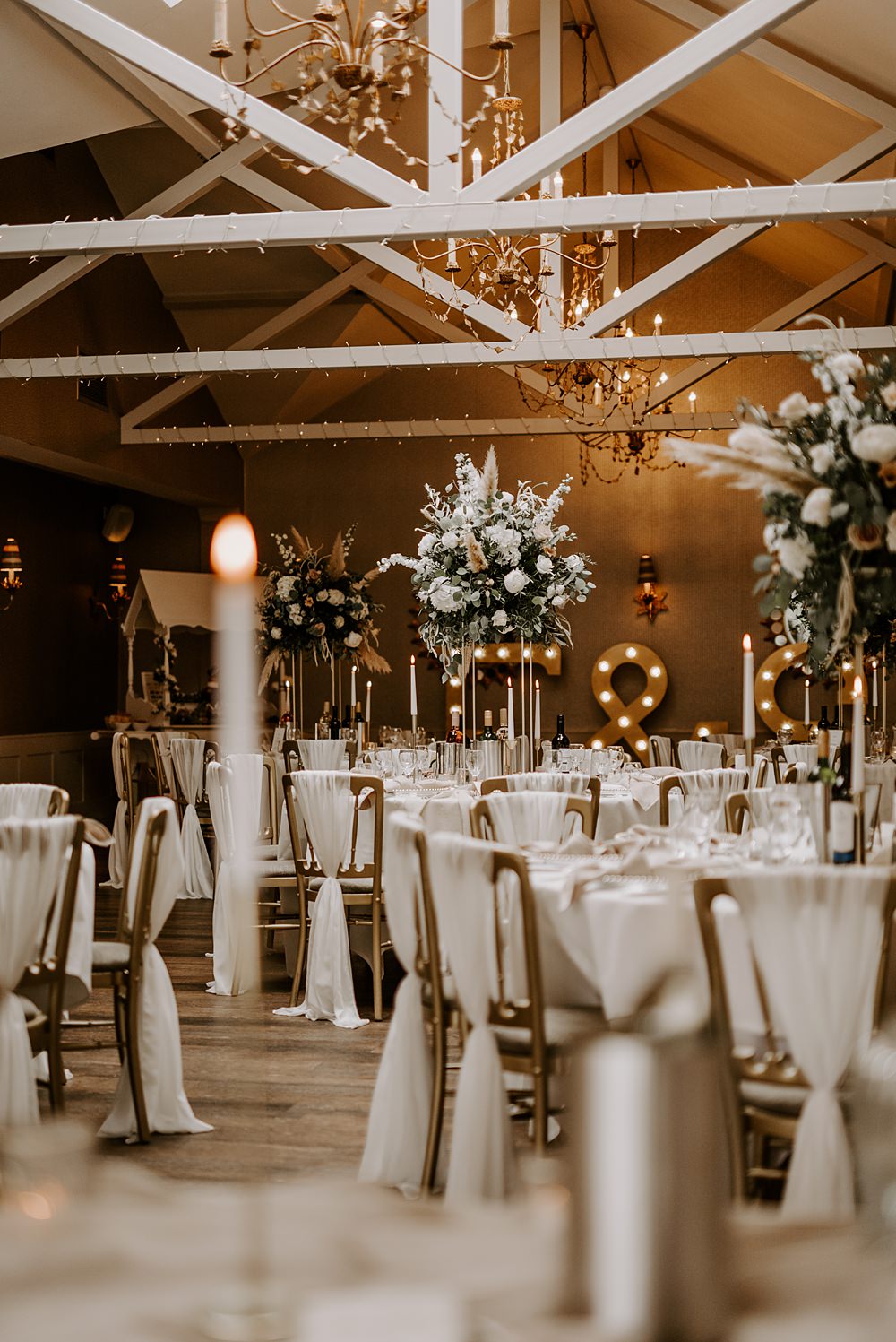 Barn Reception Tall Flowers Chair Sash Cockliffe Country House Wedding The Light Painters