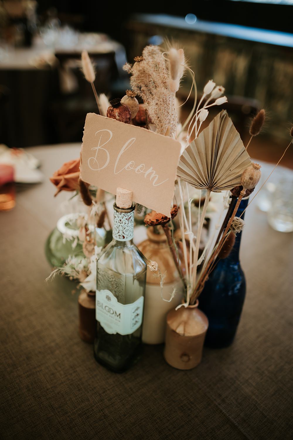 Centrepiece Flowers Bottles Dried Palms Table Name Kent Woodland Wedding Paul Fuller Photography