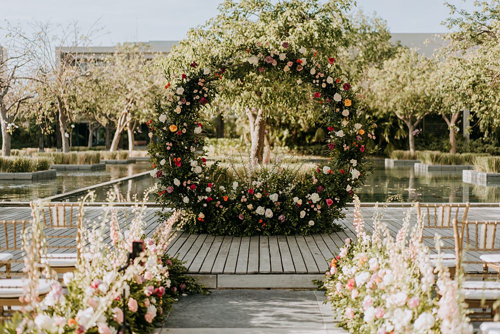 Ceremony Aisle Flowers Greenery Meadow Moon Gate Hoop Nizuc Resort Wedding Kape Photography