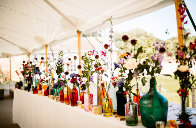 Top Table Wedding Decor Flowers Colourful Bottles Hayley Baxter Photography