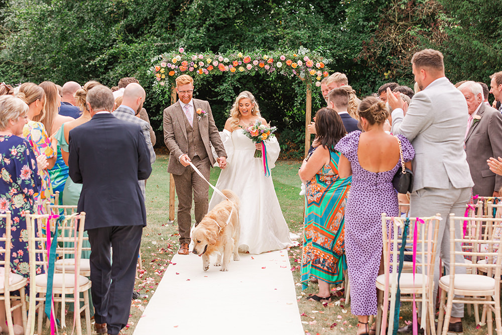 Flower Arch Rainbow Ribbons Chairs Ceremony Outdoor Holbrook Manor Wedding James & Kerrie Photography