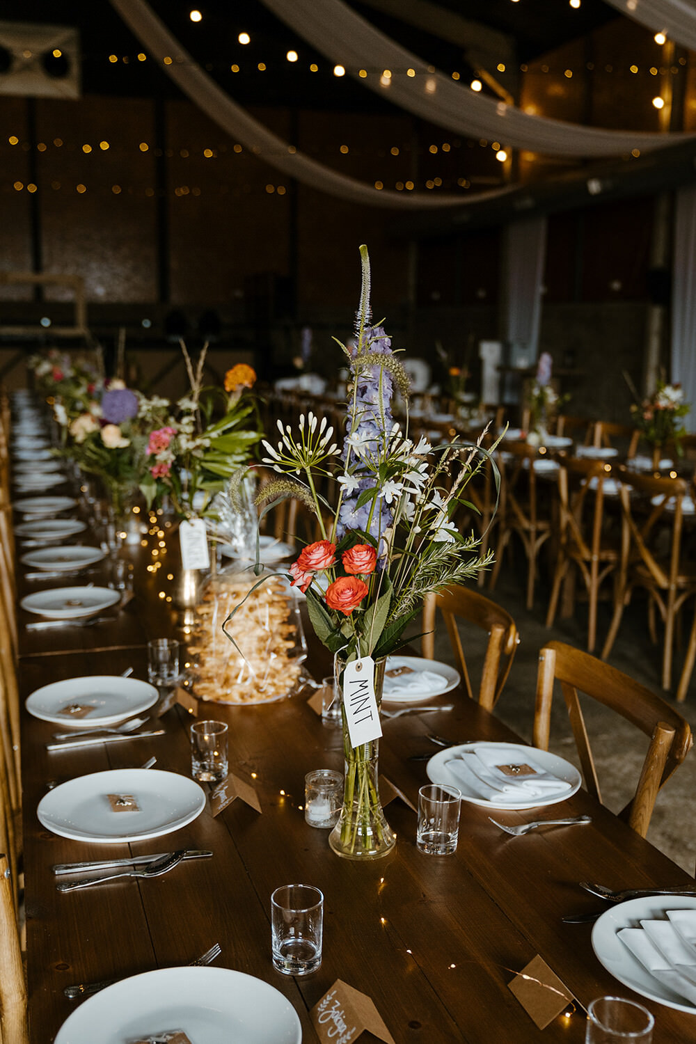 Long Wooden Tables Barn Decor Flowers Indian Lithuanian Wedding Ellie Gillard Photography