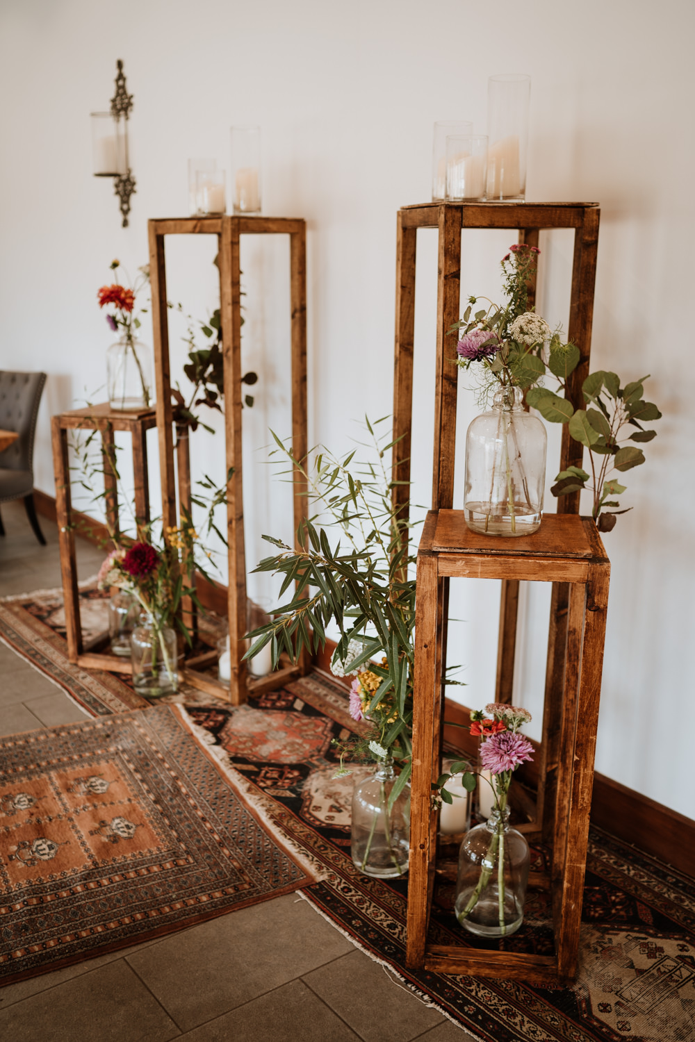 Aisle Backdrop Wooden Tower Flowers Rug Ceremony Kent Farm Barn Wedding Nicola Dawson Photography
