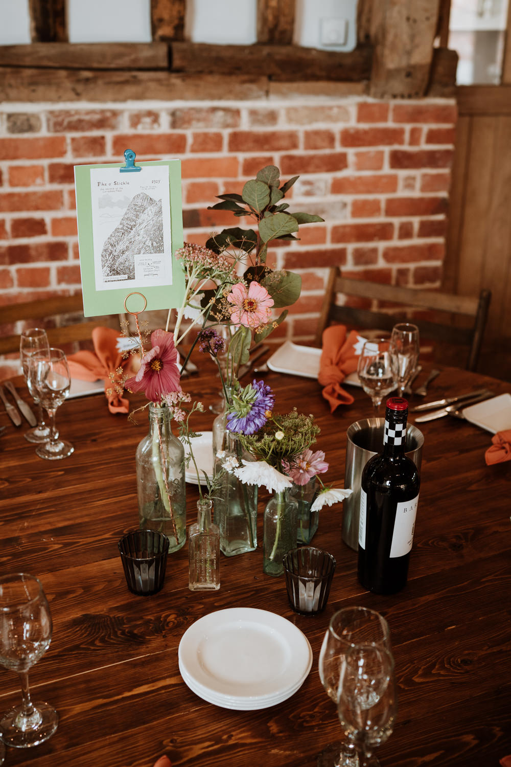 Summer Flowers Bottles Centrepiece Kent Farm Barn Wedding Nicola Dawson Photography
