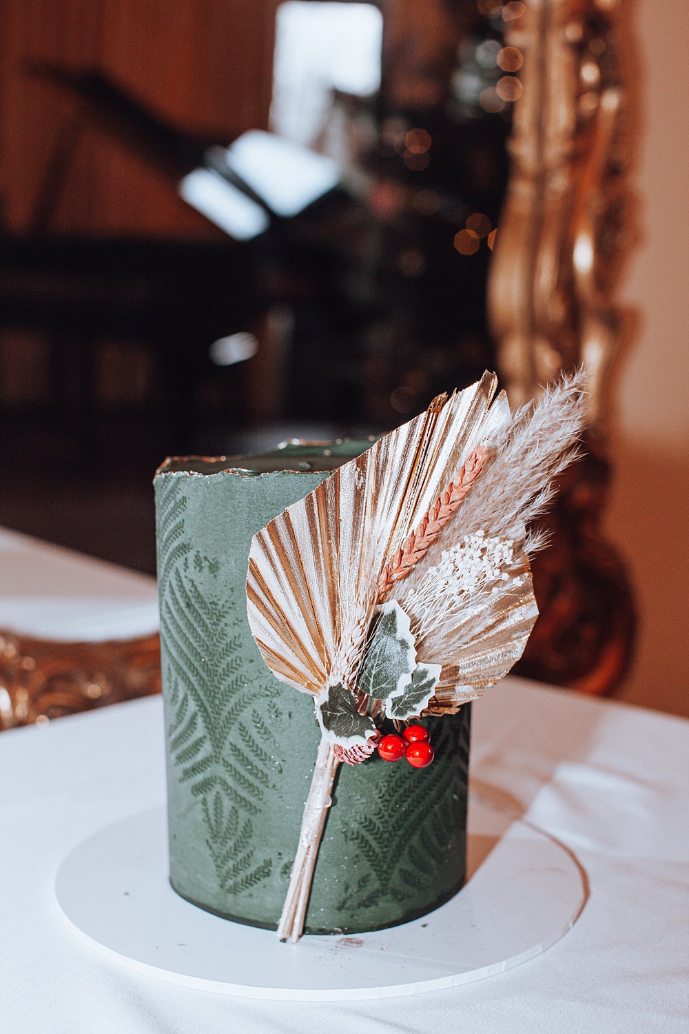 Green Cake Gold Leaf Red Berry Christmas Wedding Theme Idea Naomi Mills Photography