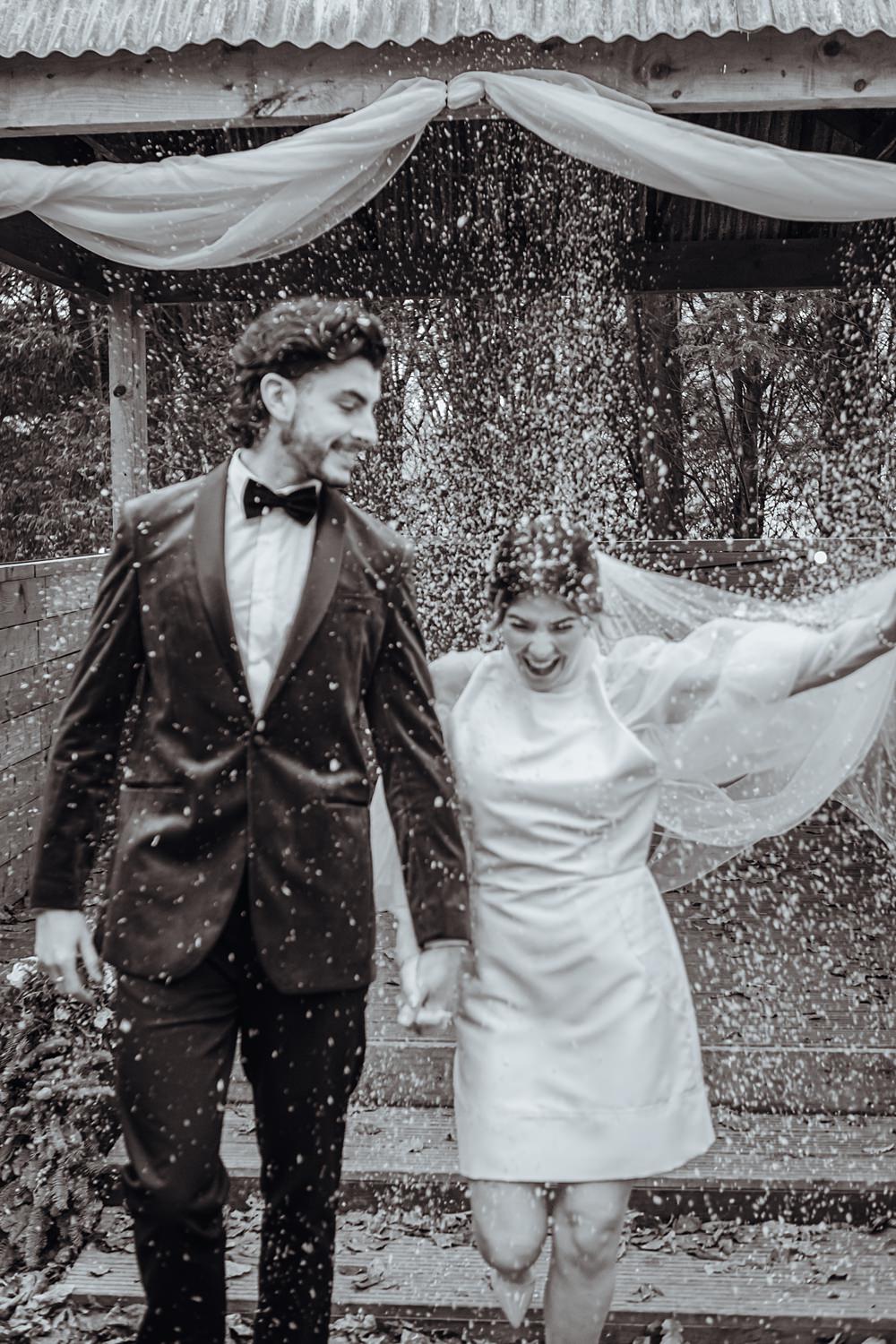 Snow Confetti Bride Groom Christmas Wedding Theme Idea Naomi Mills Photography