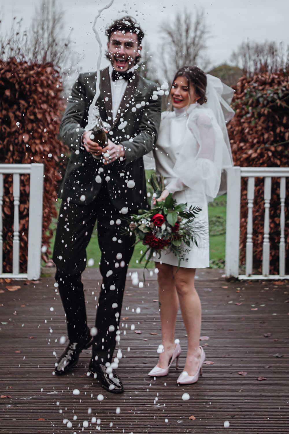 Champagne Pop Bride Groom Christmas Wedding Theme Idea Naomi Mills Photography