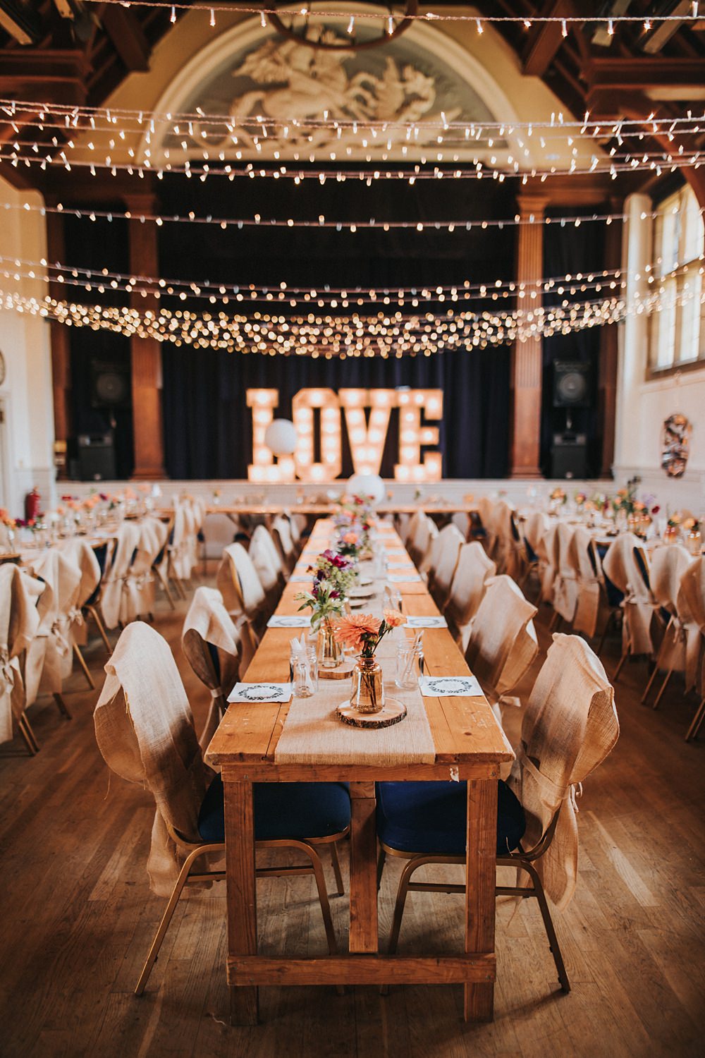 Fairy Lights Love Letters Long Wooden Tables Decor Kent Village Hall Wedding Holly Rose Weddings