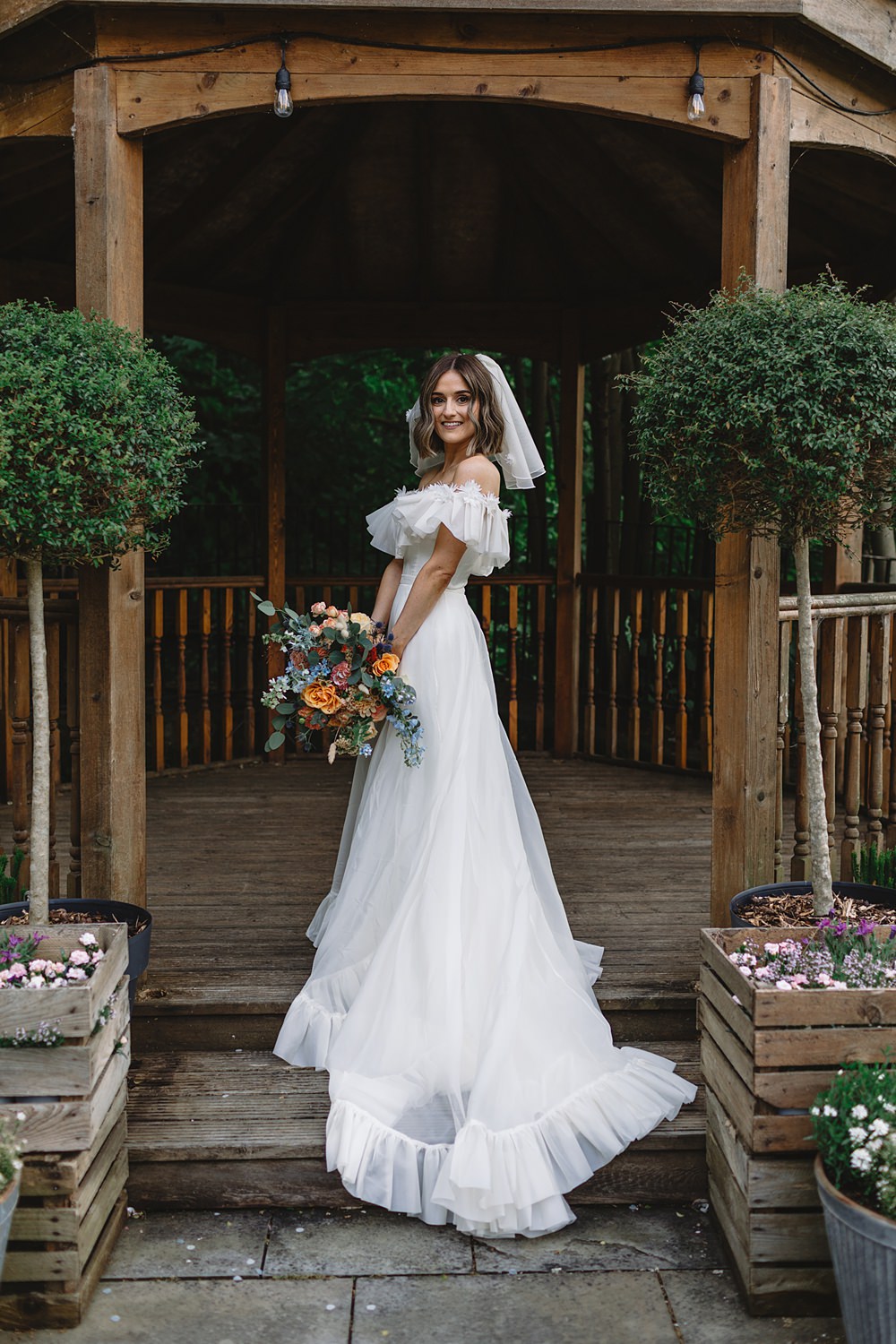 Dress Gown Off Shoulder Ruffle Bride Freda Bennet Streamers Wedding Decor Louise Barry Photographer