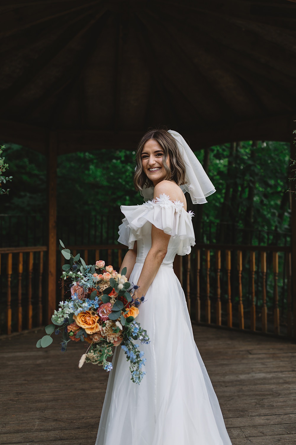 Dress Gown Off Shoulder Ruffle Bride Freda Bennet Streamers Wedding Decor Louise Barry Photographer