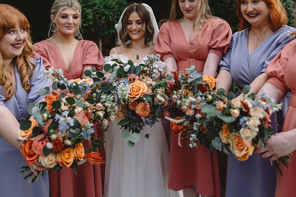 Bridesmaid Bouquets Orange Streamers Wedding Decor Louise Barry Photographer
