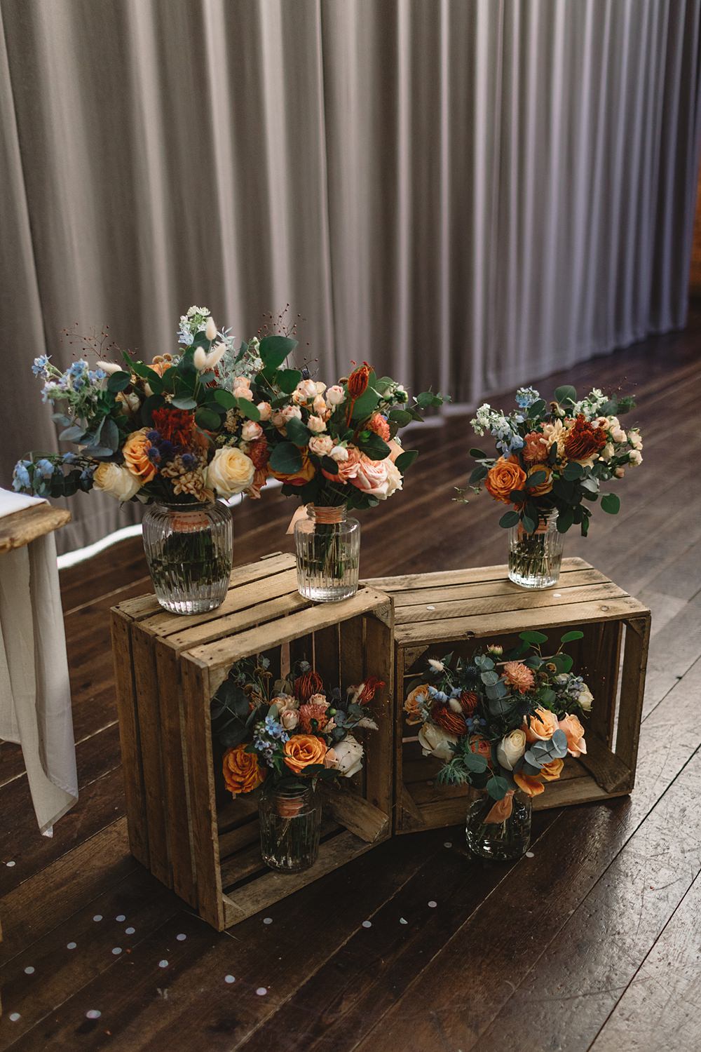 Bouquet Flowers Jar Orange Peach Wooden Crates Streamers Wedding Decor Louise Barry Photographer