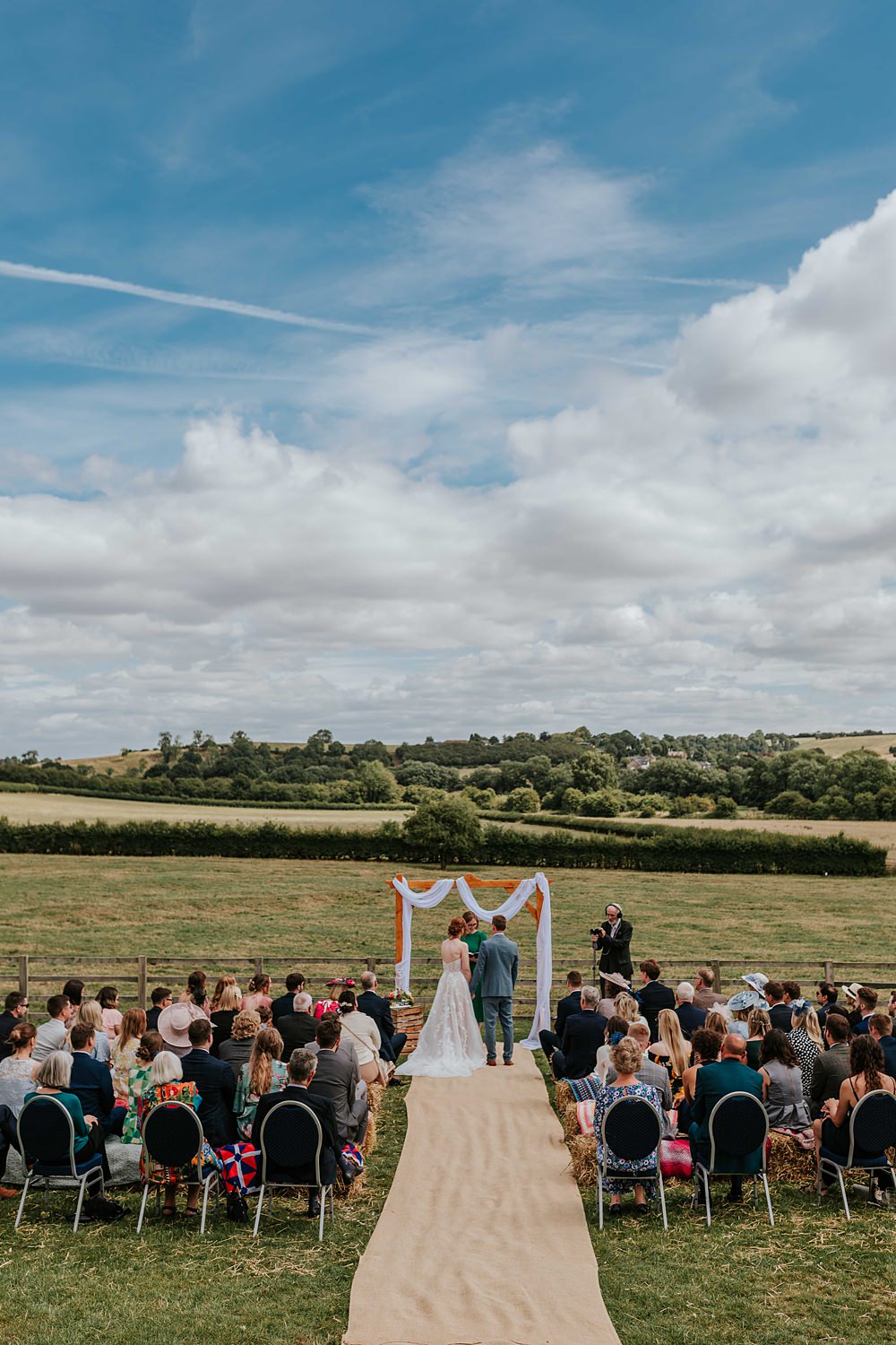 Outdoor Ceremony Wooden Arch Backdrop Yorkshire Village Hall Wedding Maddie Farris Photography