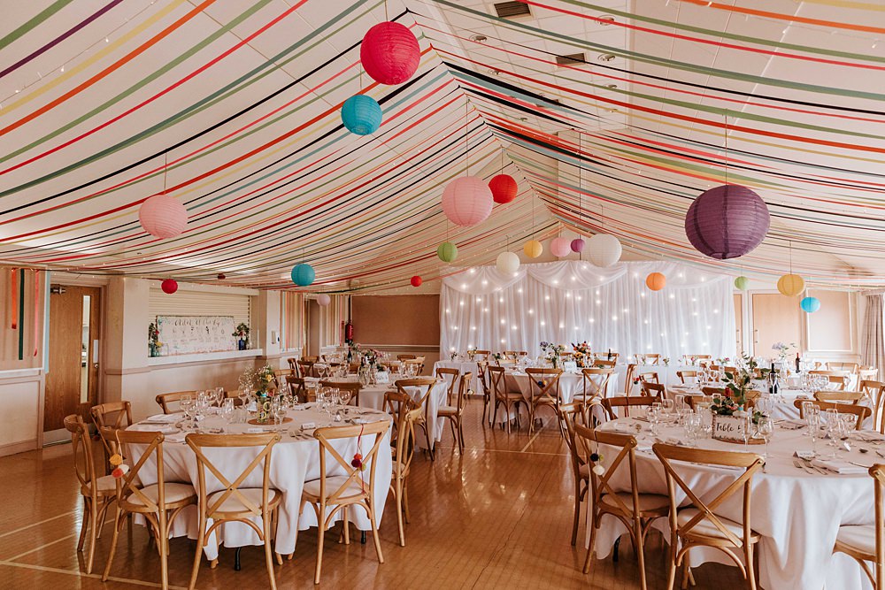 Streamers Lanterns Colourful Fairy Light Curtain Decor Yorkshire Village Hall Wedding Maddie Farris Photography