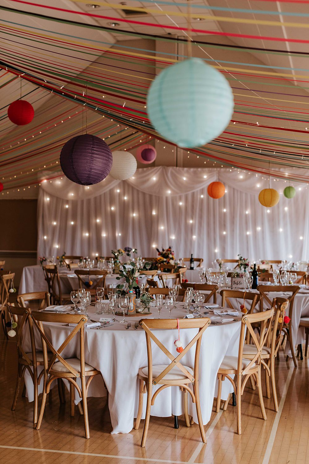 Streamers Lanterns Colourful Fairy Light Curtain Decor Yorkshire Village Hall Wedding Maddie Farris Photography