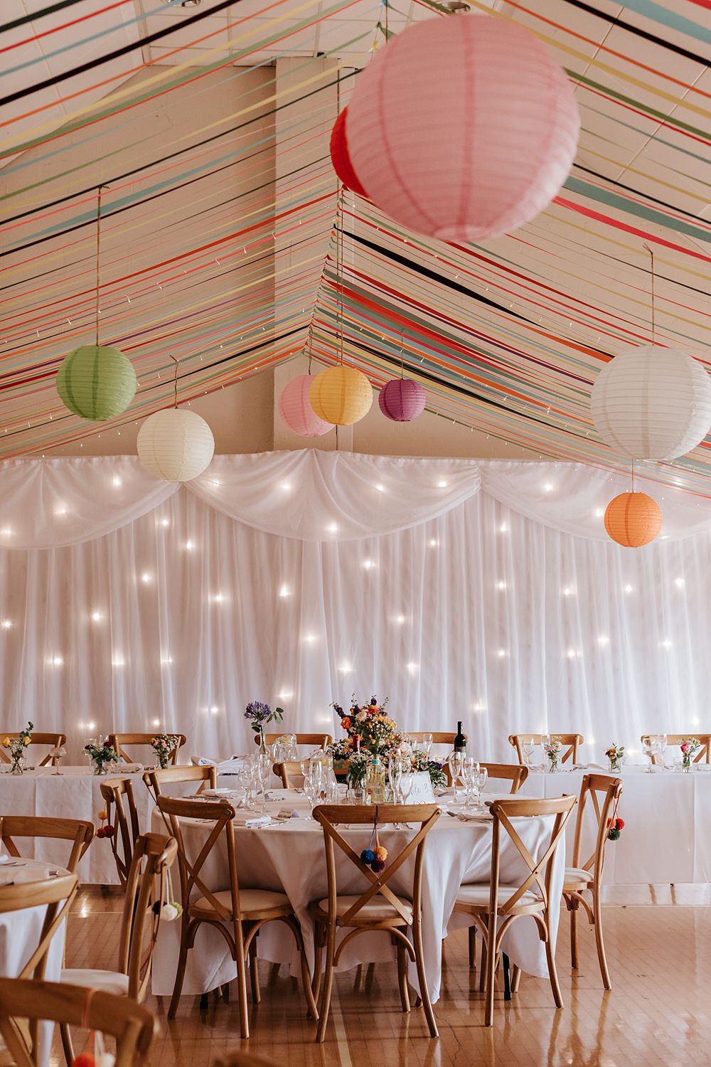 Streamers Lanterns Colourful Fairy Light Curtain Decor Yorkshire Village Hall Wedding Maddie Farris Photography