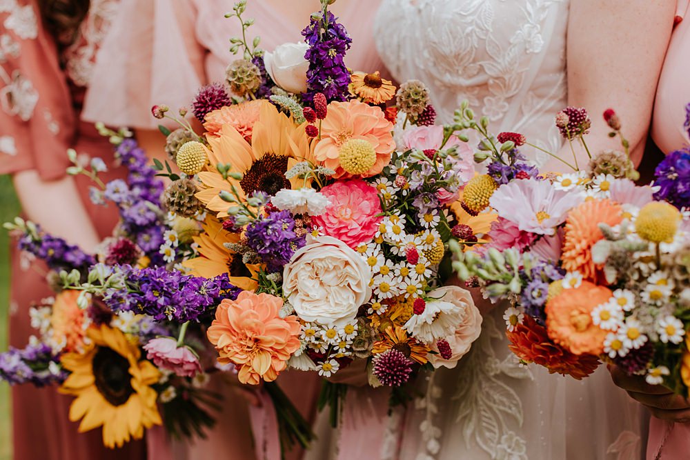 Colourful Bridal Bouquet Pink Yellow Sunflowers Daisy Bridesmaids Yorkshire Village Hall Wedding Maddie Farris Photography