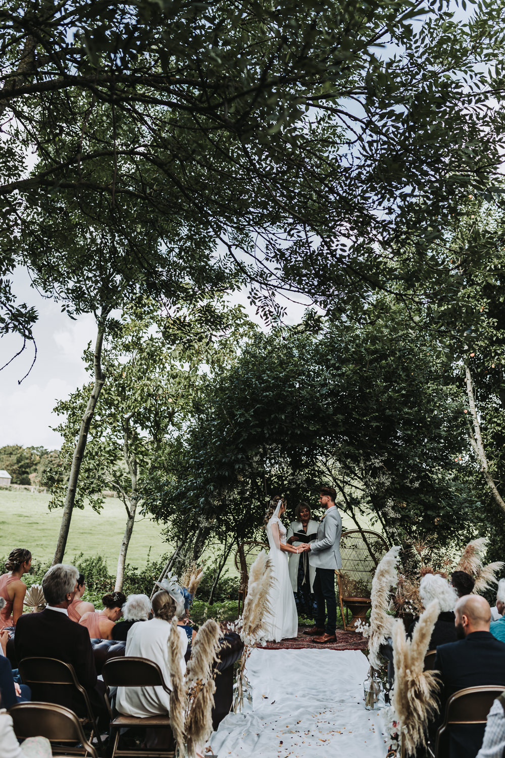 Willow Arch Ceremony Rug Aisle Yurt Village Wedding Mollie McAusland Photography