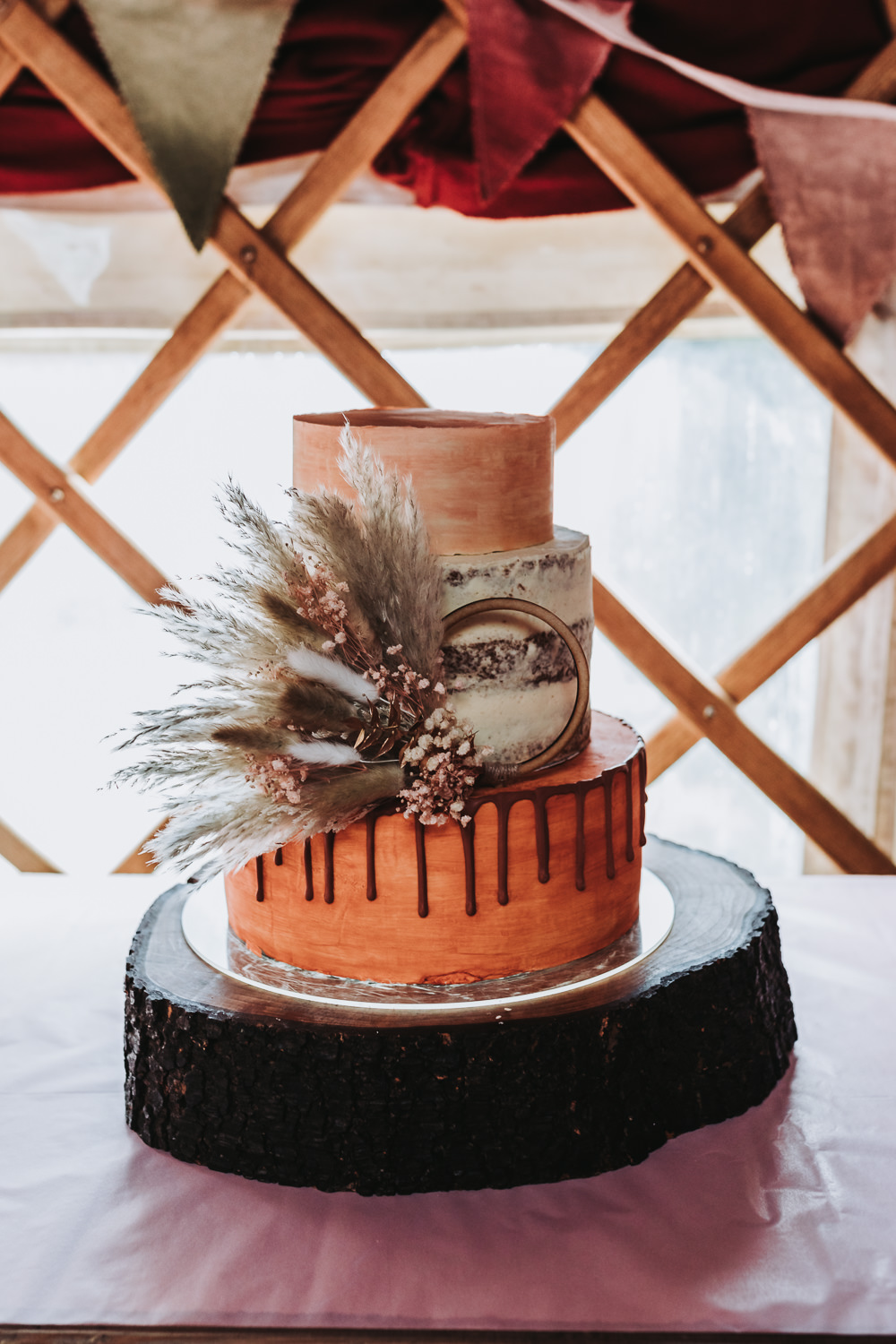3 Tier Cake Orange Dried Flower Hoop Yurt Village Wedding Mollie McAusland Photography