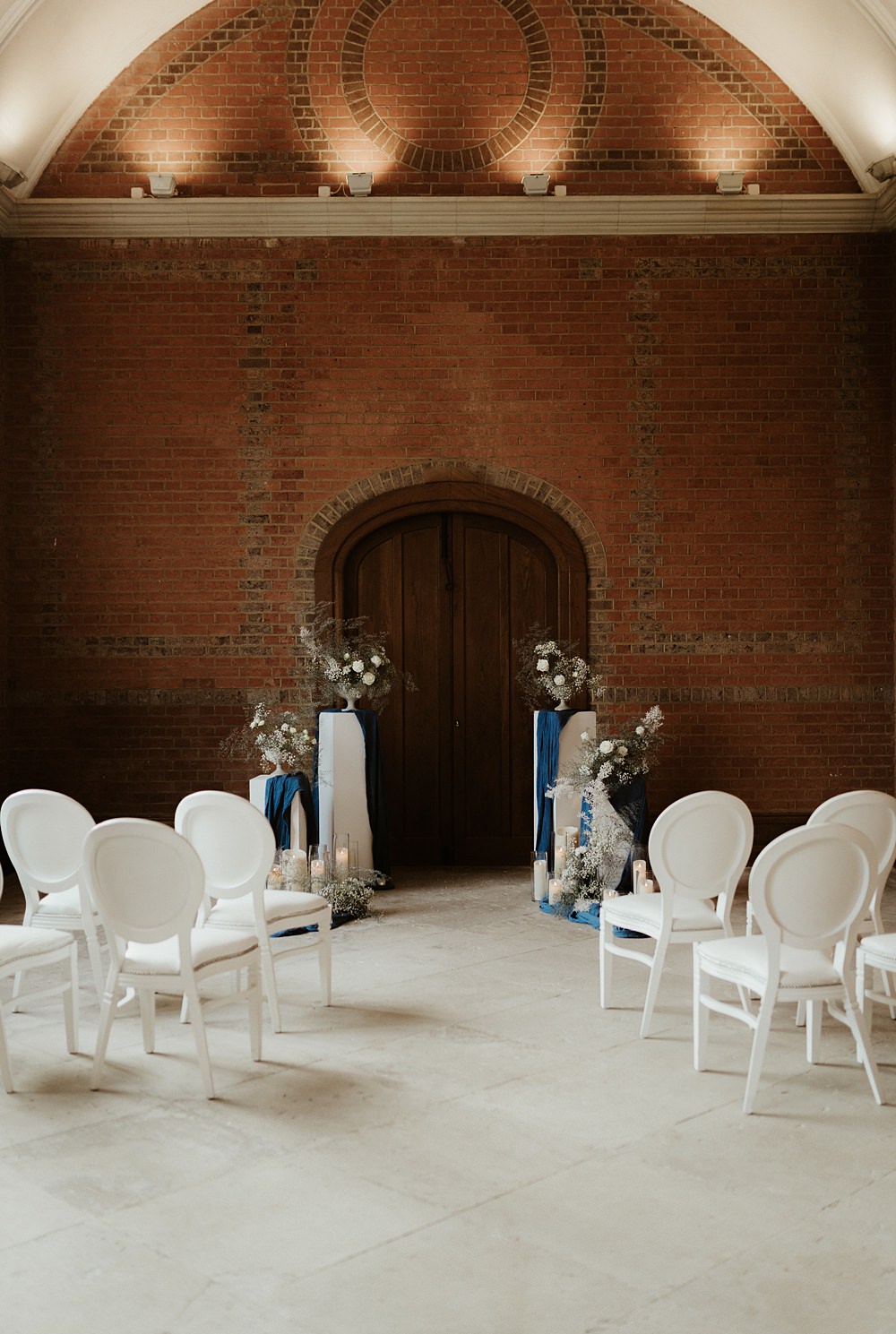 Ceremony Backdrop Pillars Flowers Candles Blue White Wedding Ideas Natalie Silvester Photography