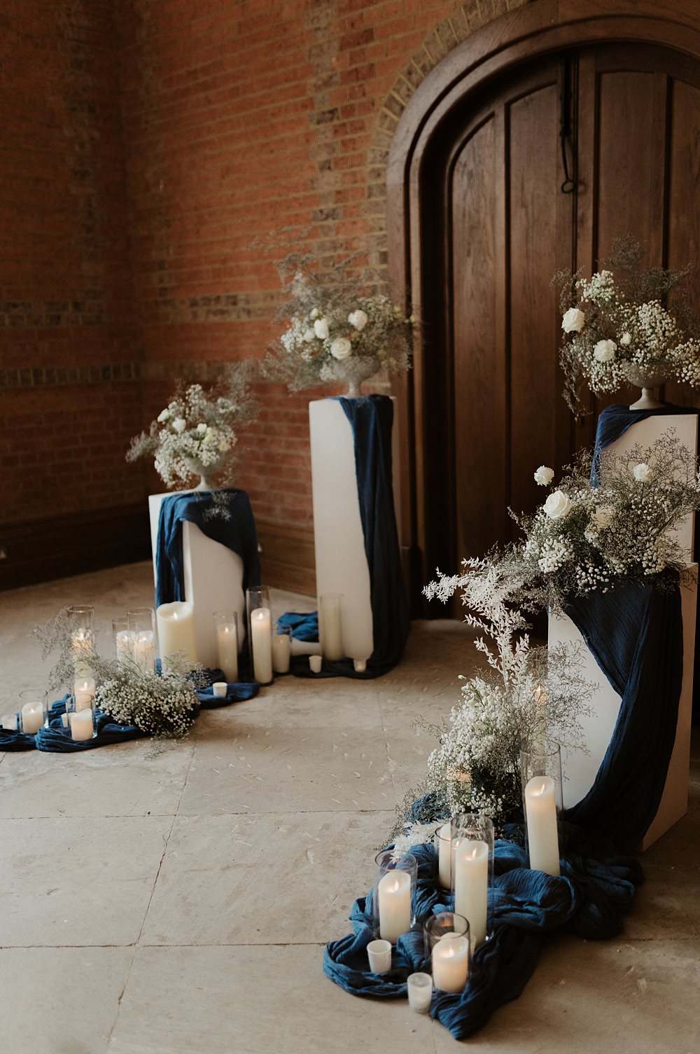 Ceremony Backdrop Pillars Flowers Candles Blue White Wedding Ideas Natalie Silvester Photography
