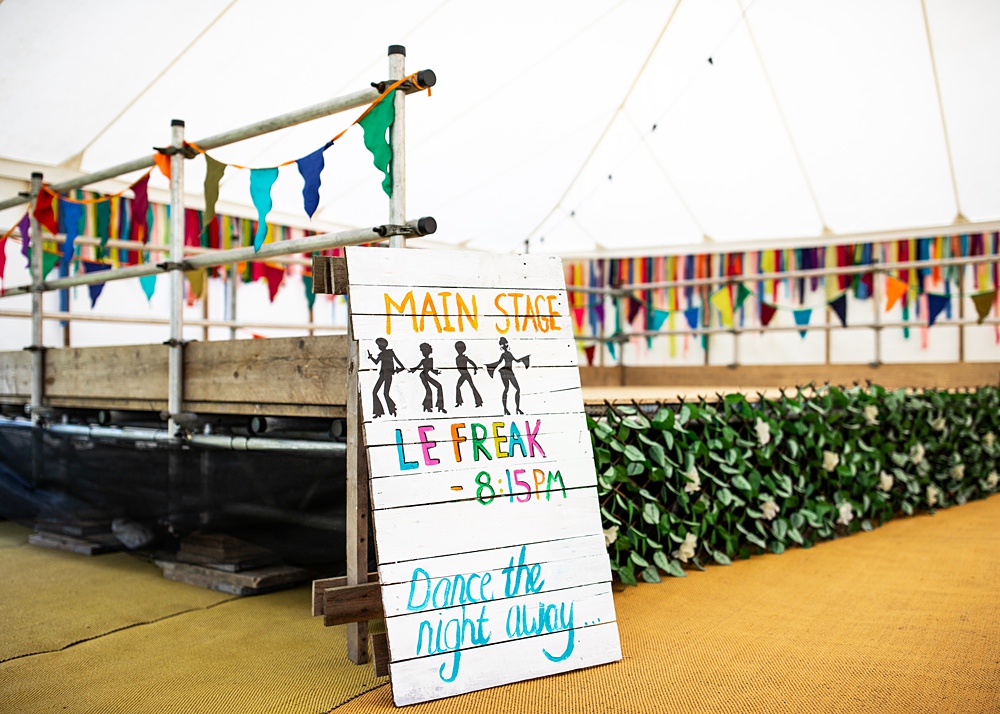 Wooden Painted Sign Stage Nortonbury Farm Wedding AD Photography