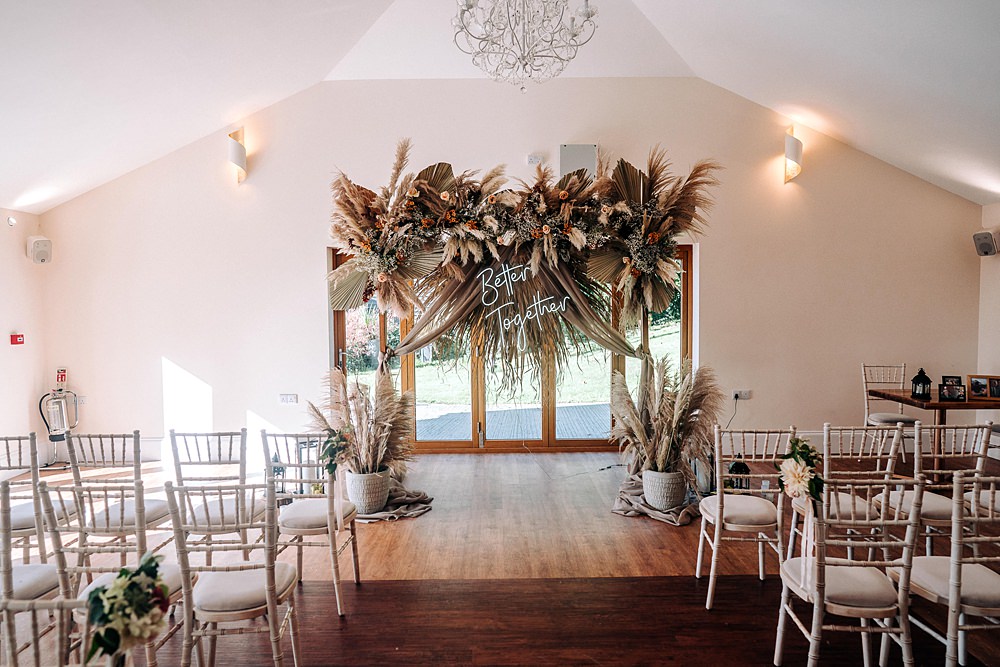 Backdrop Neon Sign Dried Flowers Ceremony Tredudwell Manor Wedding Dan Ward Photography