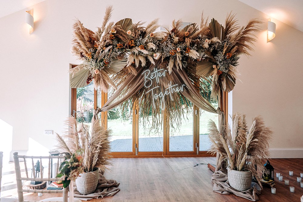 Backdrop Neon Sign Dried Flowers Ceremony Tredudwell Manor Wedding Dan Ward Photography