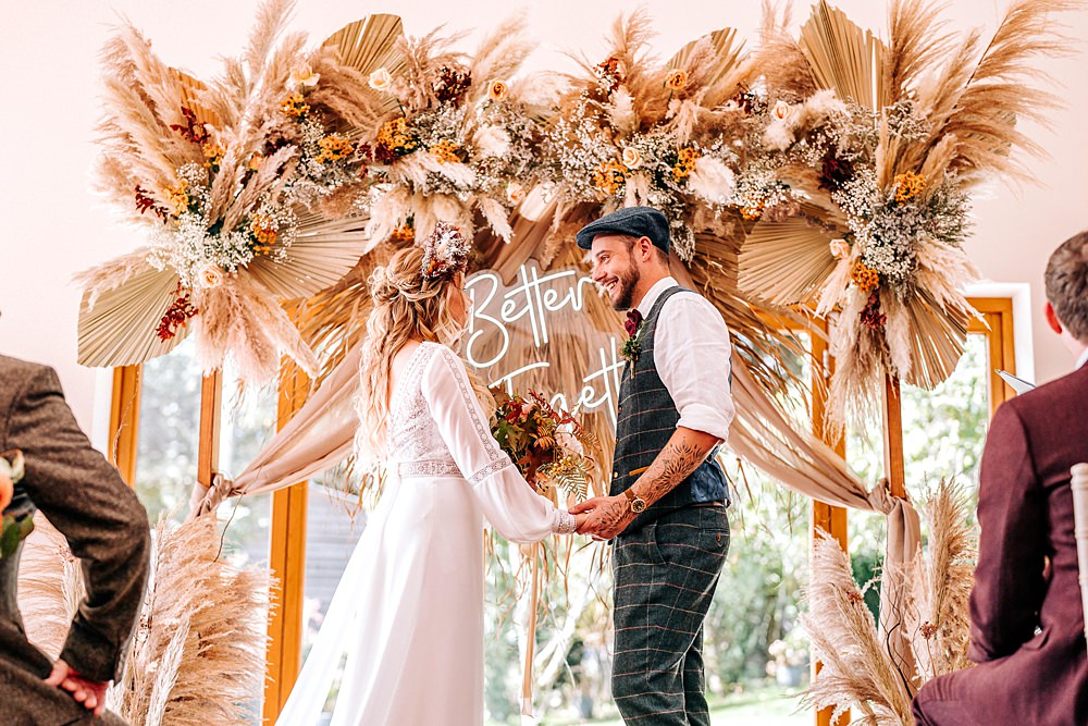 Tredudwell Manor Wedding Dan Ward Photography Backdrop Neon Sign Dried Flowers Ceremony