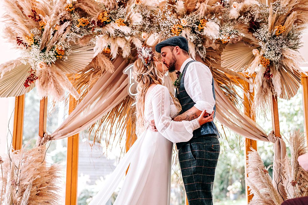Tredudwell Manor Wedding Dan Ward Photography Backdrop Neon Sign Dried Flowers Ceremony