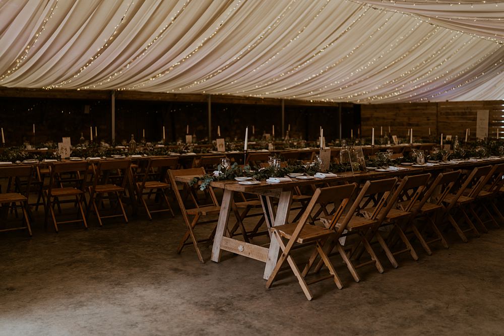 Marquee Lined Roof Reception Long Wooden Tables Warm Celestial Wedding Firewood Film
