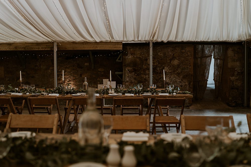 Marquee Lined Roof Reception Long Wooden Table Warm Celestial Wedding Firewood Film