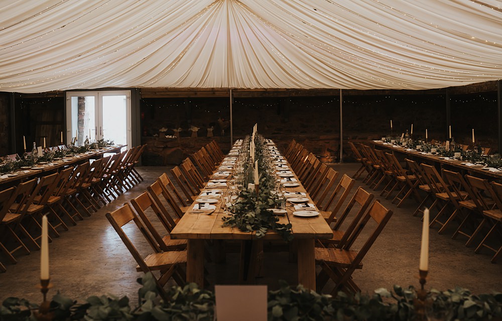Marquee Lined Roof Reception Long Wooden Table Warm Celestial Wedding Firewood Film